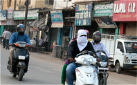 Index woman covers her face protecting herself from vehicular traffic e1435829426338 meitu 1