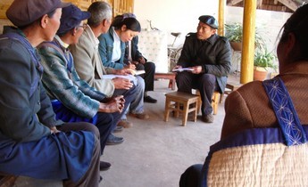 Aside yu holding meeting will village elders at lashi lake watershed project 1020x765