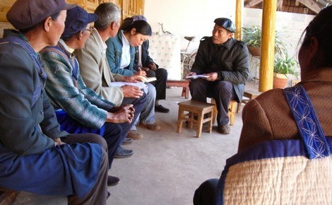 Sidebar_yu-holding-meeting-will-village-elders-at-lashi-lake-watershed-project-1020x765