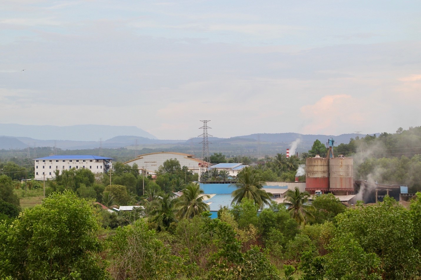 Smoke rises from the coal ash processing plant, six kilometres down the road from the coal plants (Image: Lili Pike) 